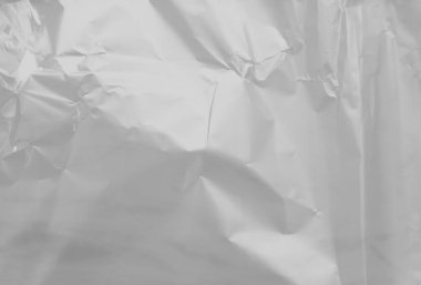 Beyaz arkaplanda boş bir plastik film dokusunun güzel yakın plan görüntüsü