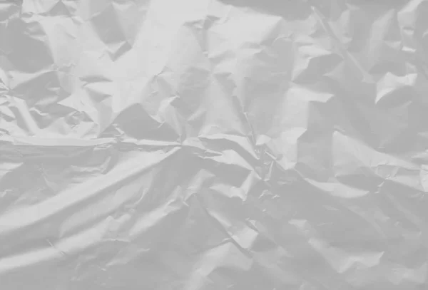 Beyaz arkaplanda boş bir plastik film dokusunun güzel yakın plan görüntüsü