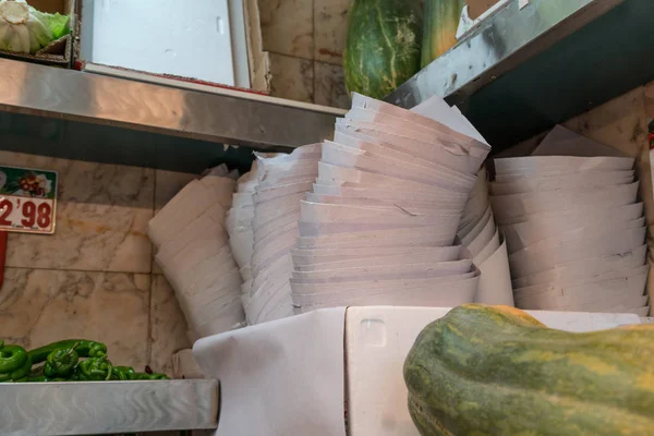 Plastic free. Stop Plastic. In the traditional market, paper is used to wrap food for a long time.