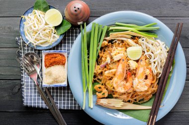 Pad Thai - Rice noodles with shrimps and vegetables close-up on 