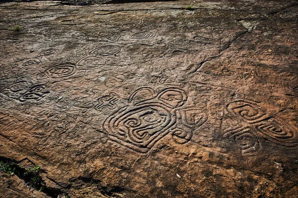 Rock paintings of ancient civilizations. Made by the aborigines of Central America by the Taino Indians. Includes ancient letters, signs and symbols. — Stock Photo, Image