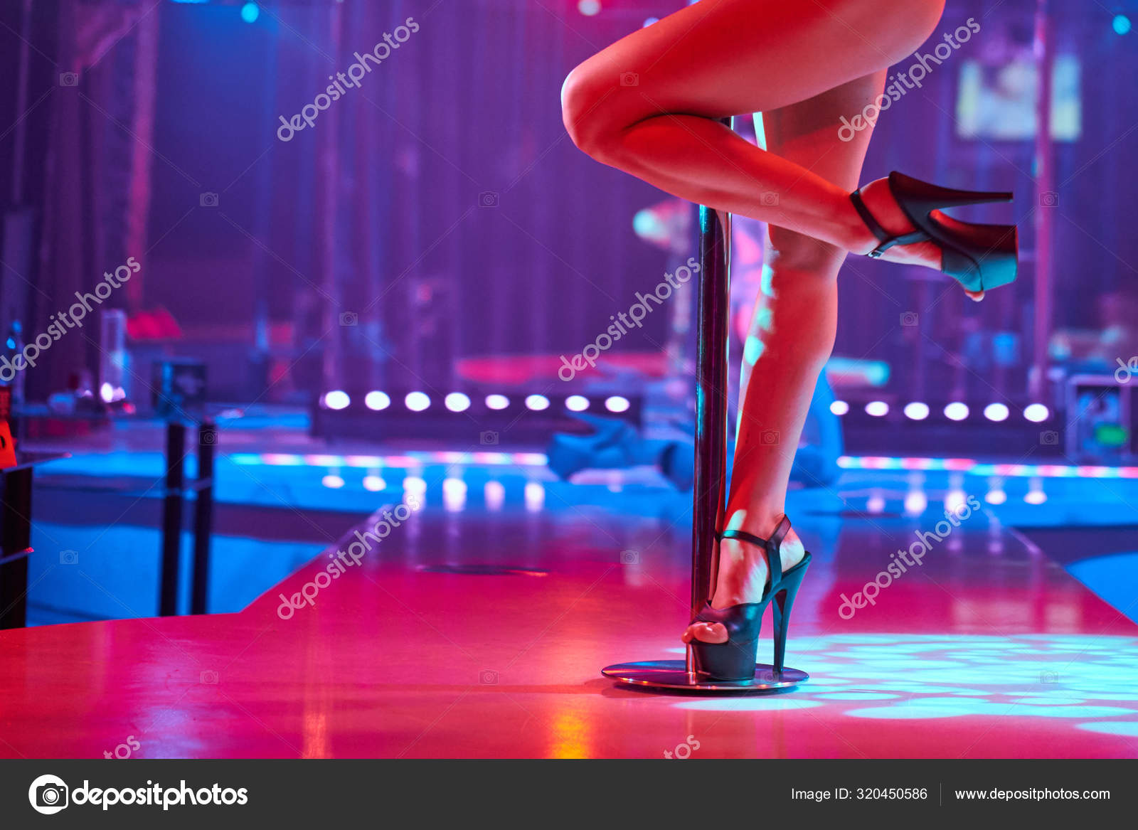 Beautiful naked stripper girl on stage. 