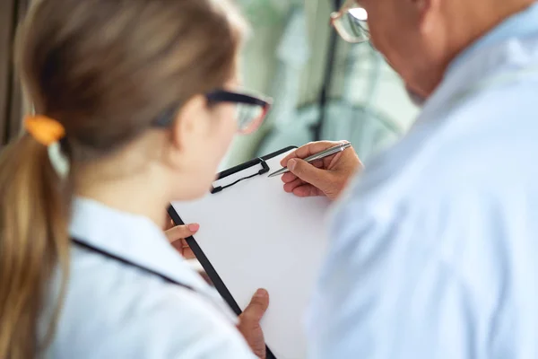 Medical Doctor Team are Discussing Conference for Examining Diagnose Their Patient Medical Report in Examination Room Together. Physician Doctors Teamwork and Medicine Healthcare Concept — Stock Photo, Image
