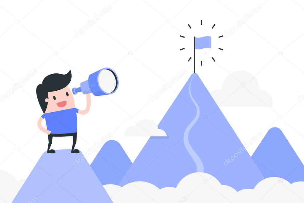 Young man standing on top of the mountain and looking to the new goal. 