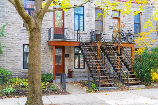 Montreal, typical victorian house with exterior staircase in the Plateau Mont-Royal district in autumn