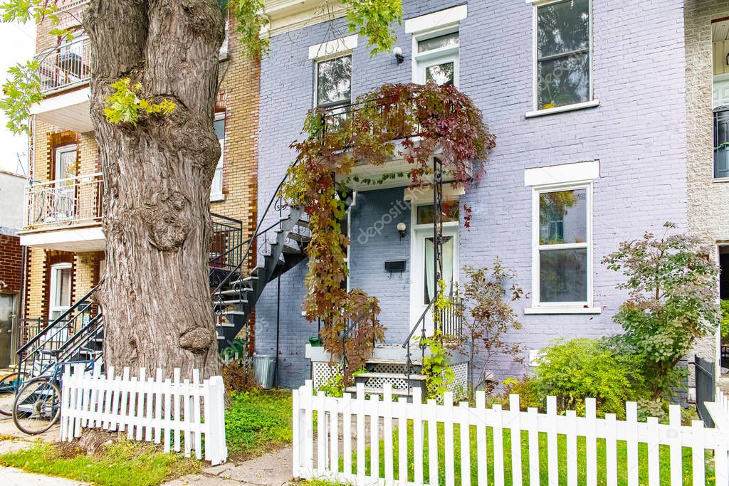 Montreal, typical victorian house with exterior staircase in the Plateau Mont-Royal district in autumn