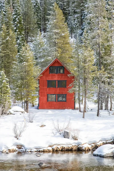 A red wooden hut isolated in the mountain, in the Sierra Nevada, California