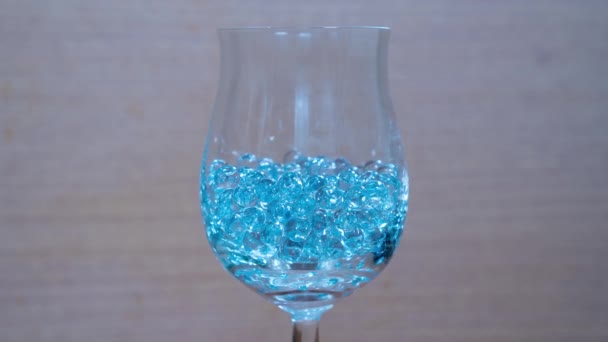 Glass beads in the goblet — Stock Video