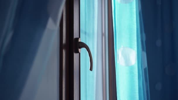 Plastic window turns the handle and opens partially upwards — Stock Footage Plastic window turns the handle and opens partially upwards Royalty Free Stock Video