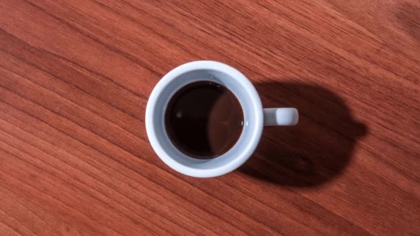 Coffee fills the cup in stop motion — Stock Video