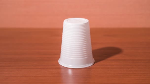 Plastic cup folds into a lump — Stock Video