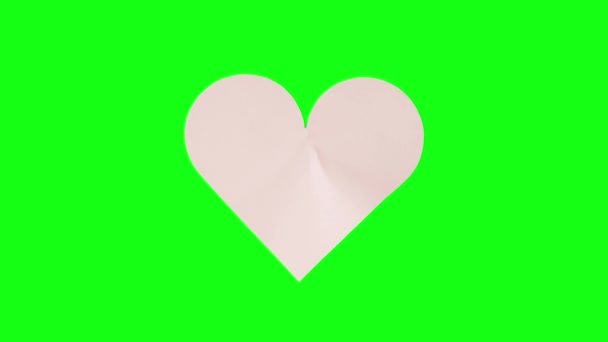 Papier coeur se brise en deux sur l'écran vert — Video