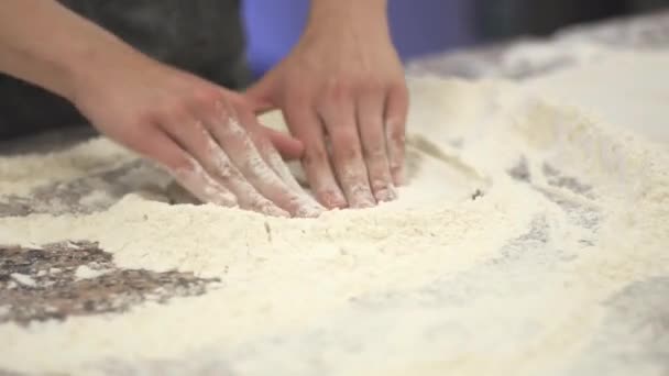 Pizza dough is worked on the table — Stock Video