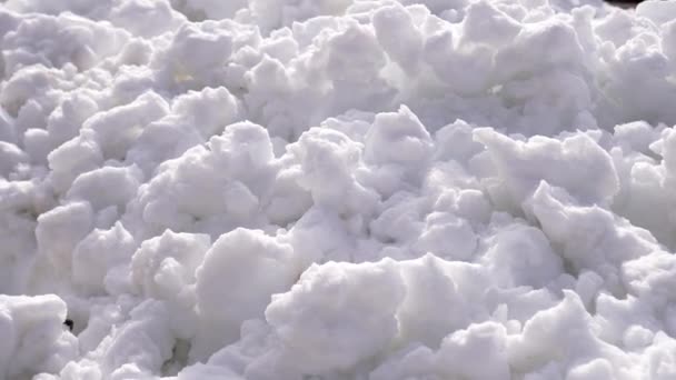 White snow lumps on a pile — Stock Video