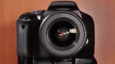 Aperture of the photographic lens opens
