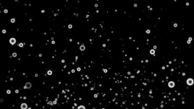 Siyah zemin üzerinde beyaz daireler çizen kasırga