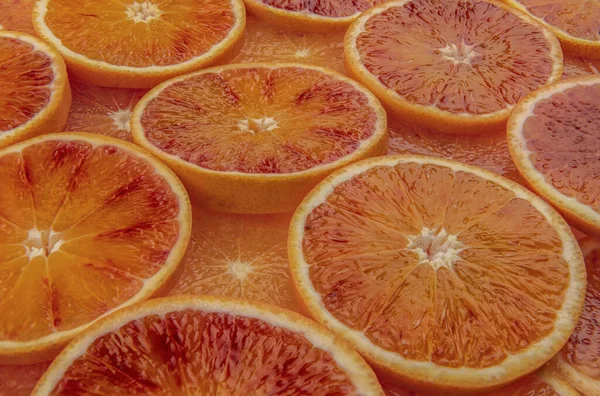 Schließen Sie Die Scheiben Geschnittenen Sizilianischen Orangen Tarocco Als Hintergrund — Stockfoto