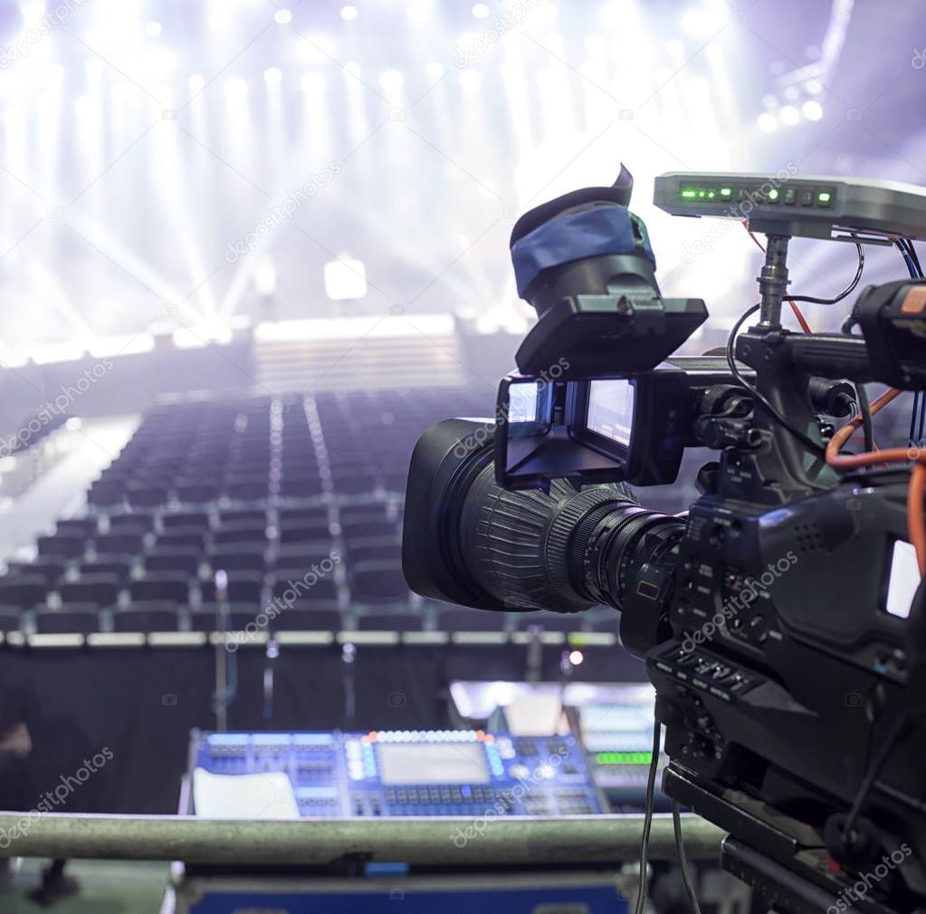 tv camera in a concert hal. Professional digital video camera.