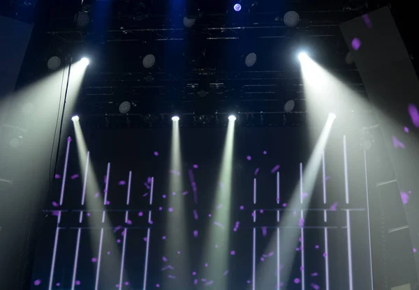 Bright beautiful rays of light on an stage before the concert.