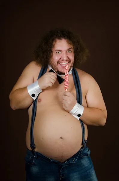 재미 있는 뚱뚱한 남자 스 트리 퍼와 사탕. — 스톡 사진