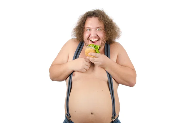 Hombre gordo comiendo una hamburguesa . — Foto de Stock