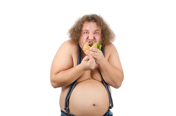 Hombre gordo comiendo una hamburguesa . — Foto de Stock