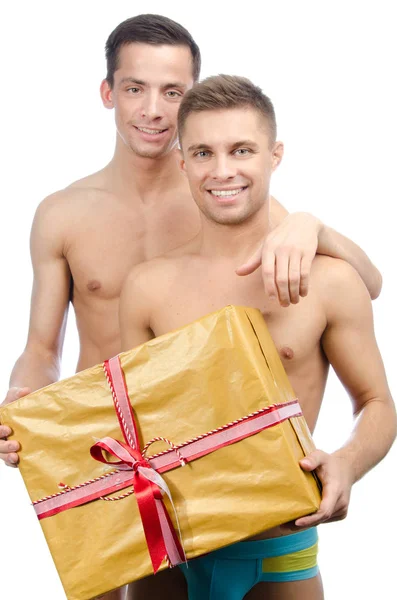 Två sexiga kille och gåva. — Stockfoto