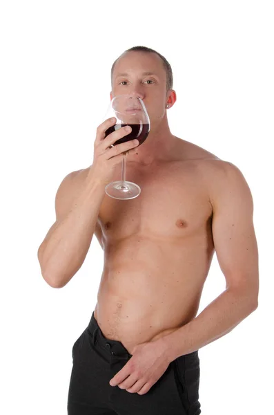 Sexy kerel en een glas rode wijn. — Stockfoto