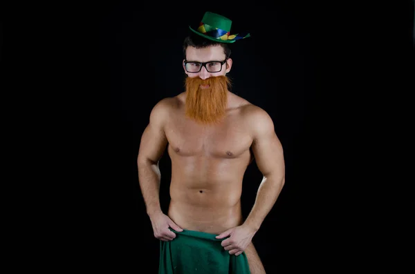 St.Patrick 's Day. Young attractive guy with a red beard.