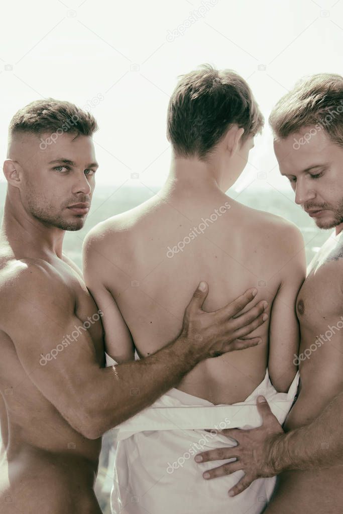 Three attractive sports guys are resting
