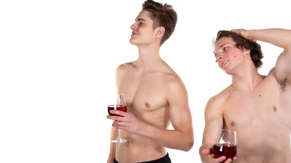二人の魅力的な男と赤ワイン ロイヤリティフリーのストック画像