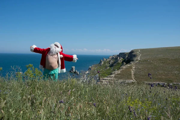 Santa Claus Vacation. Funny fat man resting in the summer.