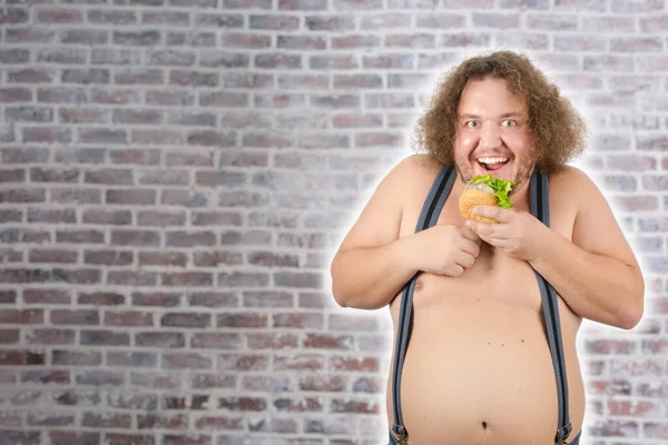 Funny fat man on a diet. - Stock Image - Everypixel Funny fat man on a diet. - Stock Image - Everypixel