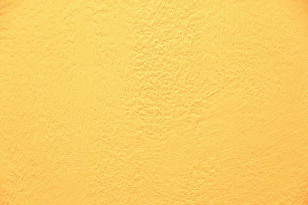 Yellow wall texture. Bright warm yellow wall background.