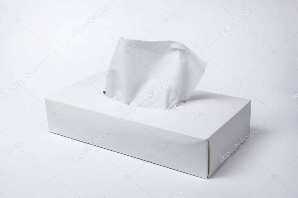 Napkins in a box on a white background. Box for napkins. Natural material.