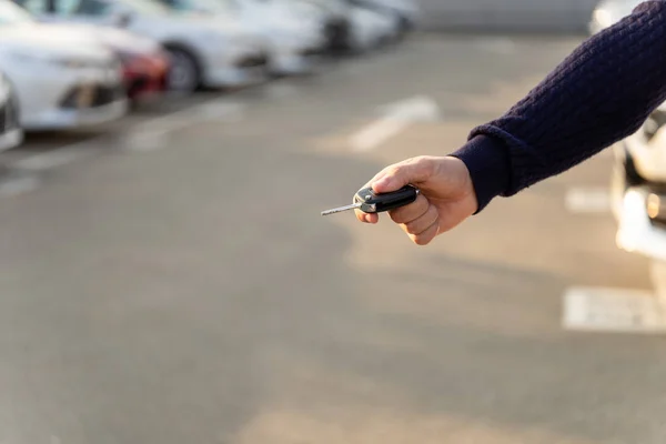 Selective focus on a key from car. Vehicle rental or sale concept. Copy space — Stock Photo, Image