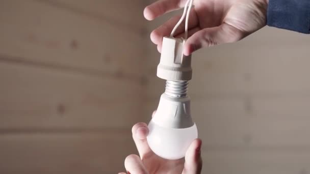 Electrician Twists Light Bulb Electrical Engineer Works Electricity Wooden Room — Stock Video