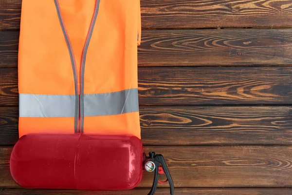 Hand Held Fire Extinguisher Fluorescent Reflective Vest Top View Dark — Stock Photo, Image