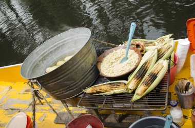 Esquites and elotes, corn, on a Trajinera boat
