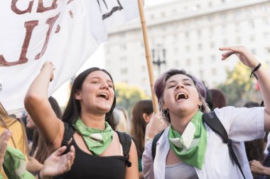 Capital Federal, Buenos Aires / Argentina; Feb 19, 2020: young girls shouting slogans in a demonstration in favor of the approval of the law of legal, safe and free abortion