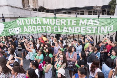 Capital Federal, Buenos Aires / Argentina; Feb 19, 2020: Not one more death due to clandestine abortion, banner in front of the National Congress; rally in favor of legal, safe and free abortion clipart