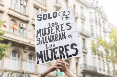 CABA, Buenos Aires / Argentina; March 9, 2020: international women's day. Detail of the rally / strike, hands holding up a sign: only women will save women
