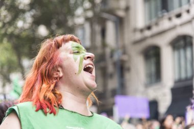 CABA, Buenos Aires / Argentina; March 9, 2020: international women's day. Woman shouting slogans in favor of the approval of the law of legal, safe and free abortion