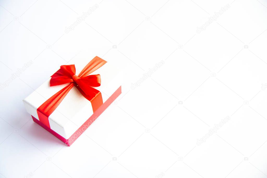 Beautiful Christmas gift box with red ribbon on isolated background. Happy New Year and merry christmas. 