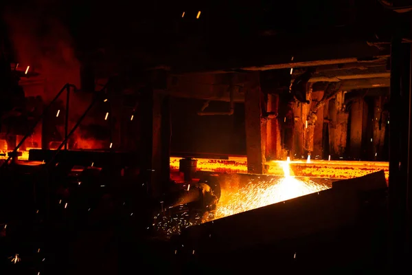 Hot red steel billets at torch cutting. Background of the blacksmith and metallurgical industry. Stock Picture