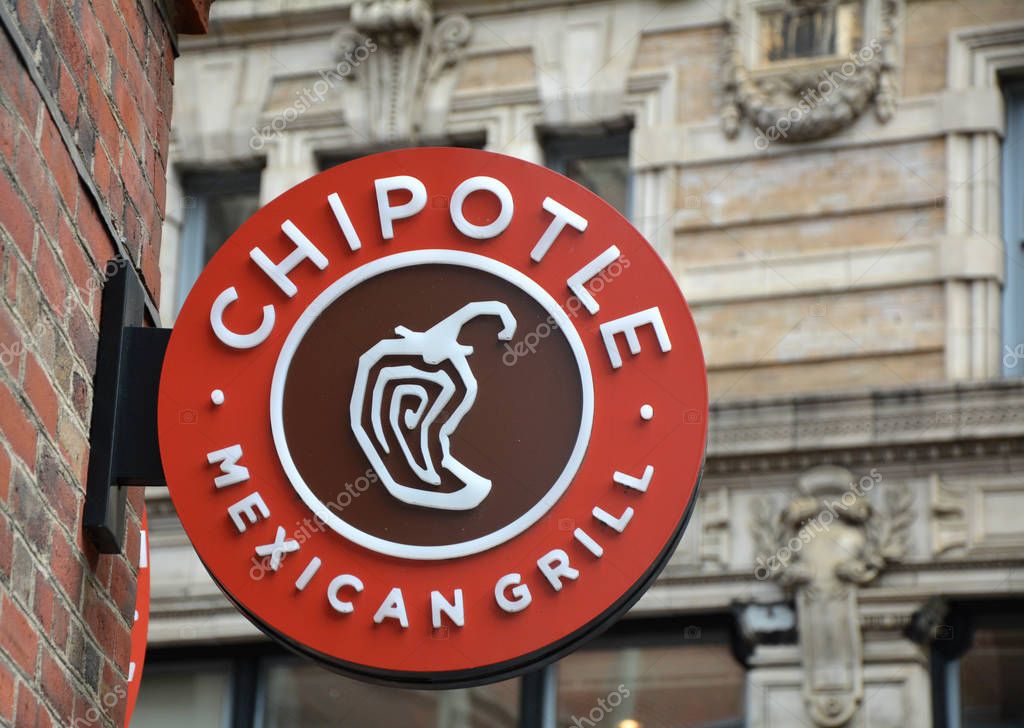 BOSTON, USA - OCTOBER 21, 2014 : Chipotle Mexican Grill signboard on the wall in Boston. Chipotle is a chain of American restaurants serving mexican food