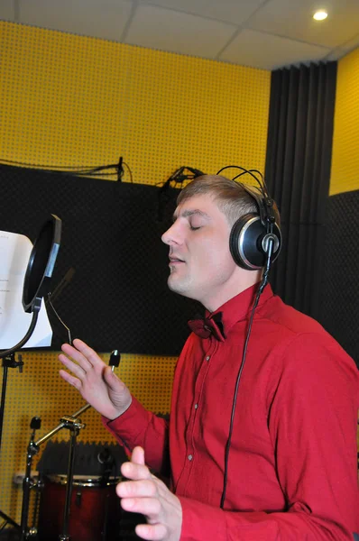 Singer, recording songs in the Studio
