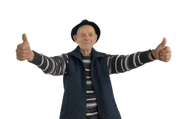 Confident, calmy senior european man with double thumbs up gesture, dressed in casual clothes and black hat, looking at the camera isolated over white background — Stock Photo, Image