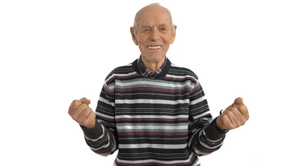 Waist up portrait of the old man in casual clothes, senior is very happy and excited doing winner gesture with arms raise, looking at the camera, isolated over white background. Celebration concept — Stock Photo, Image