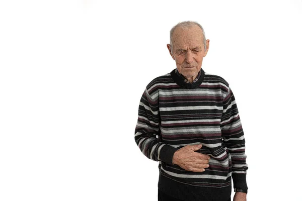 Old mature man in casual clothes overwhelmed with a pain in the stomach isolated on white background, copyspace for your text — Stock Photo, Image